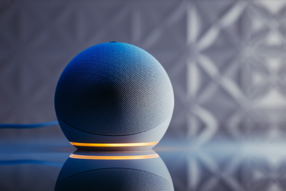 a blue ball on a black surface