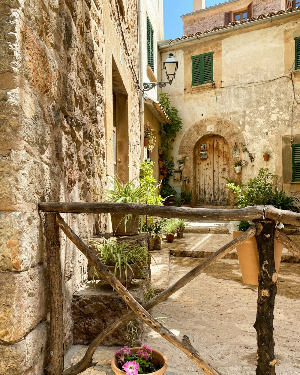 a stone walkway between buildings