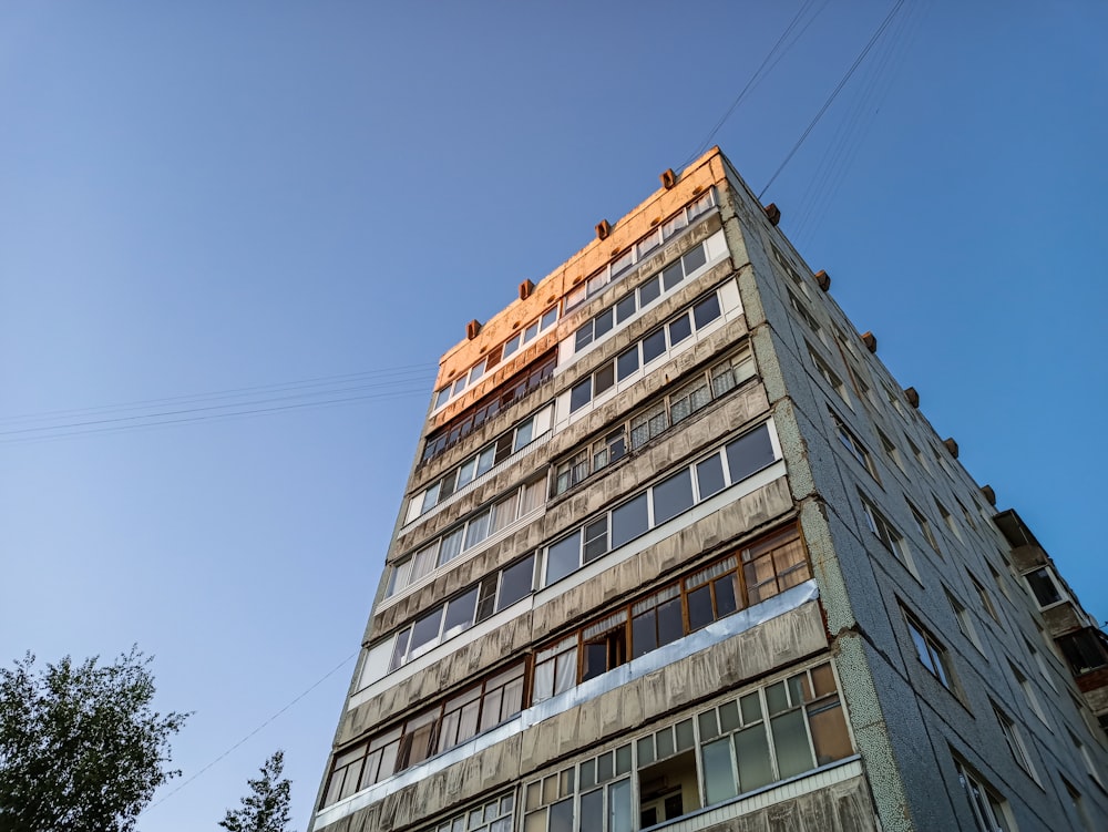 a tall building with a blue sky