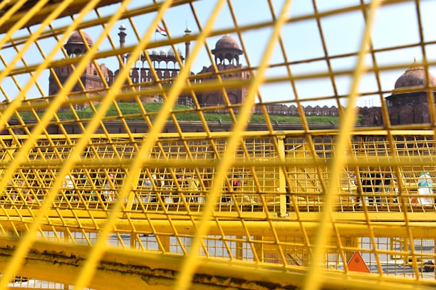 A scenic view of the Amber Fort in Jaipur under a clear blue sky.