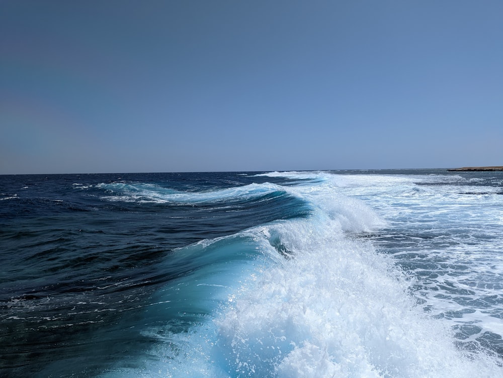 a body of water with waves