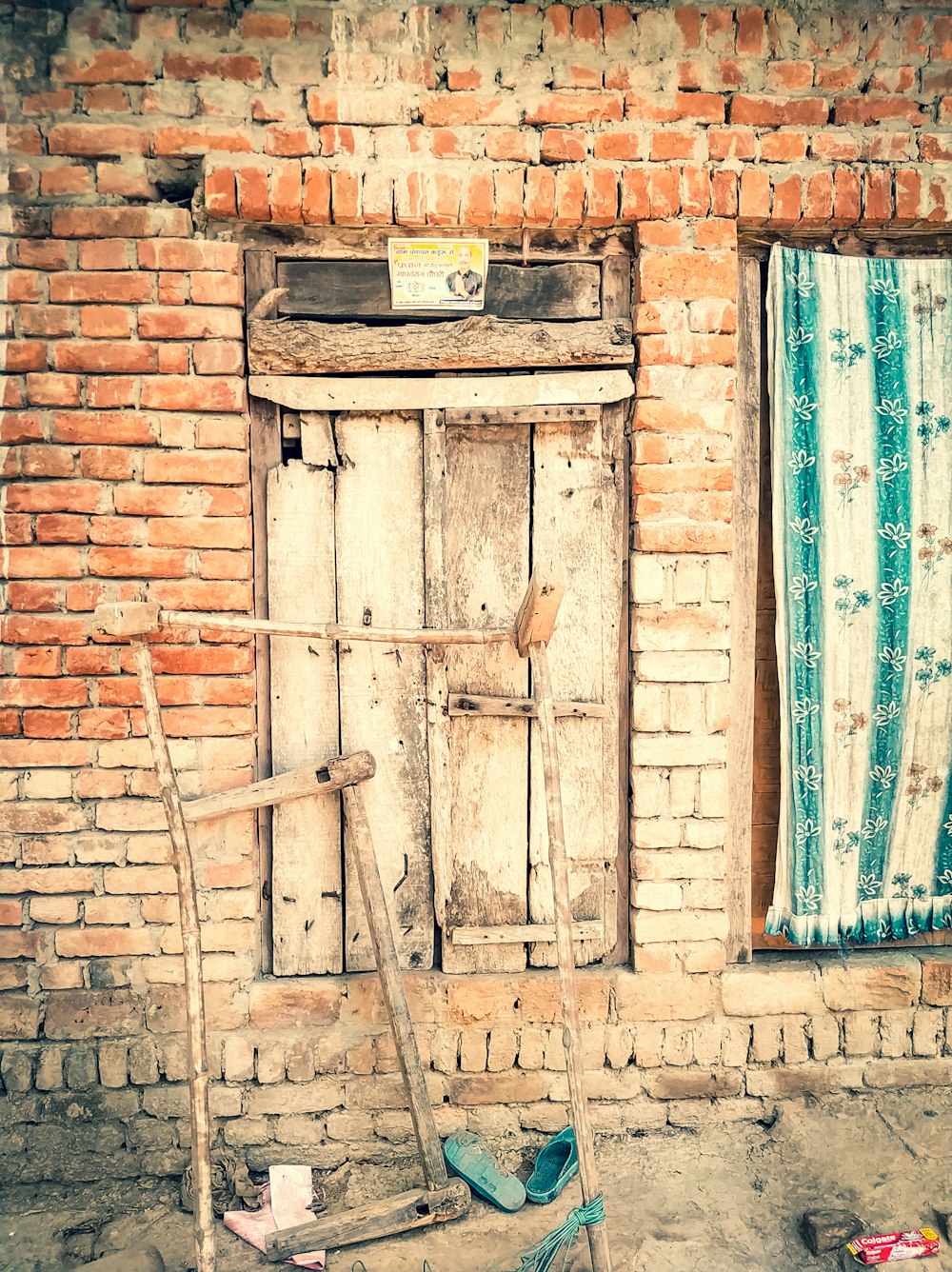a wooden door in a brick wall
