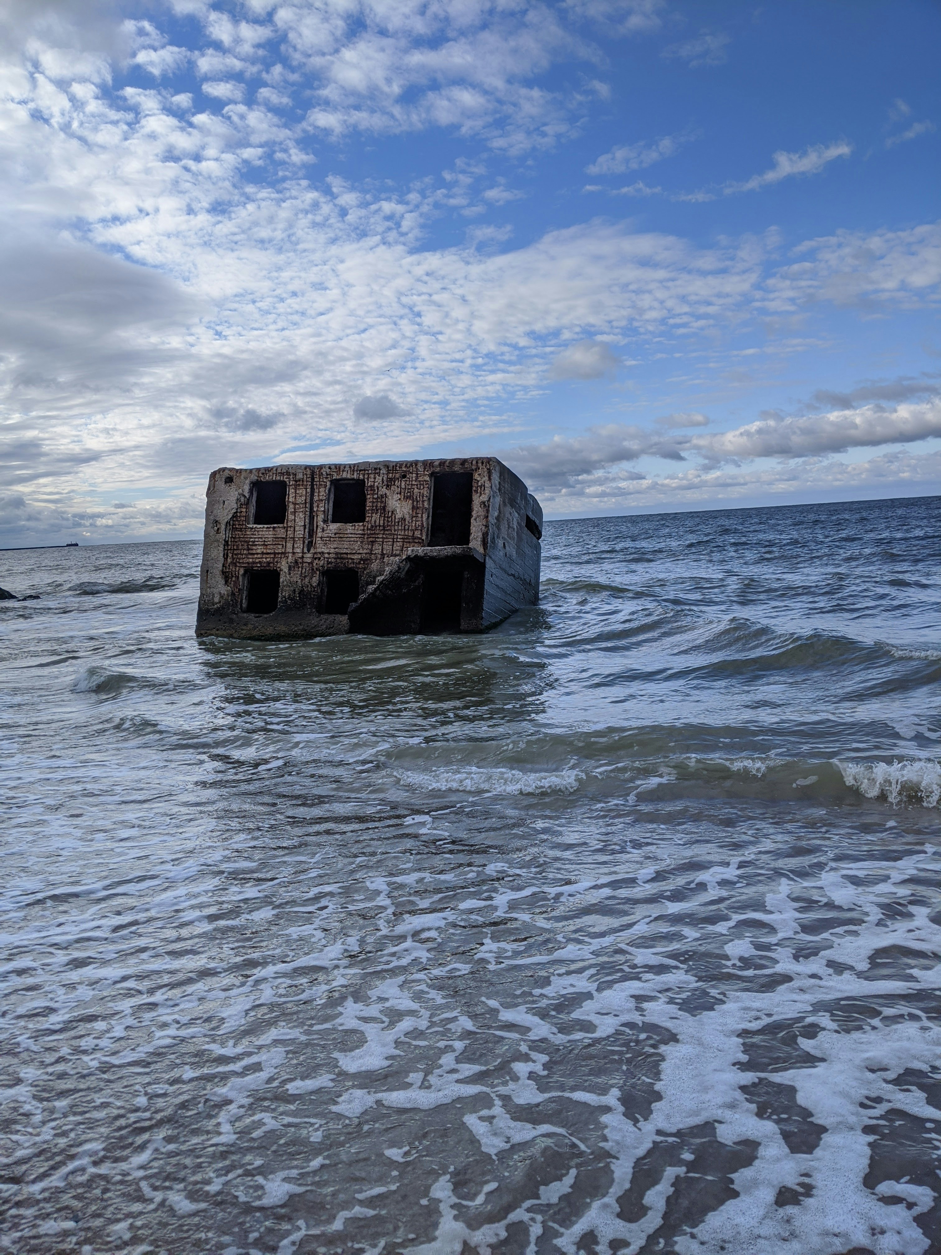 a building in the middle of the ocean