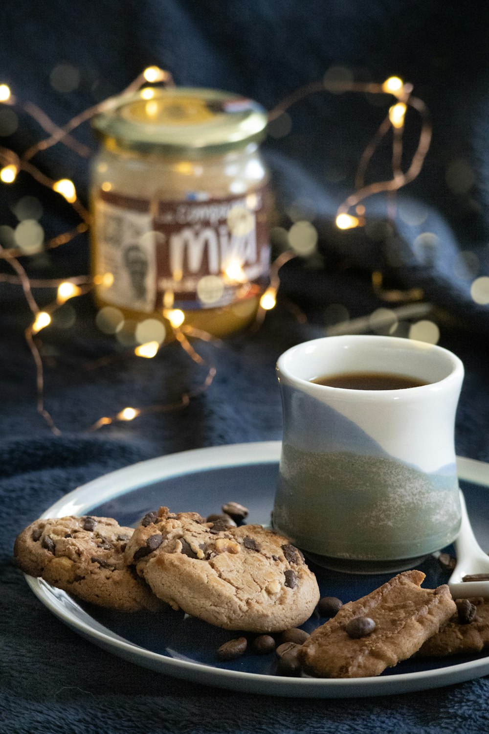 a plate of cookies and a cup of coffee