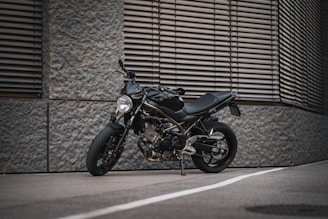 A sleek, modern motorcycle displayed against a clean, urban backdrop.
