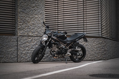 A sleek, modern motorcycle displayed against a clean, urban backdrop.