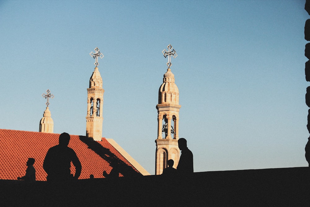 a building with a tower and a cross on top