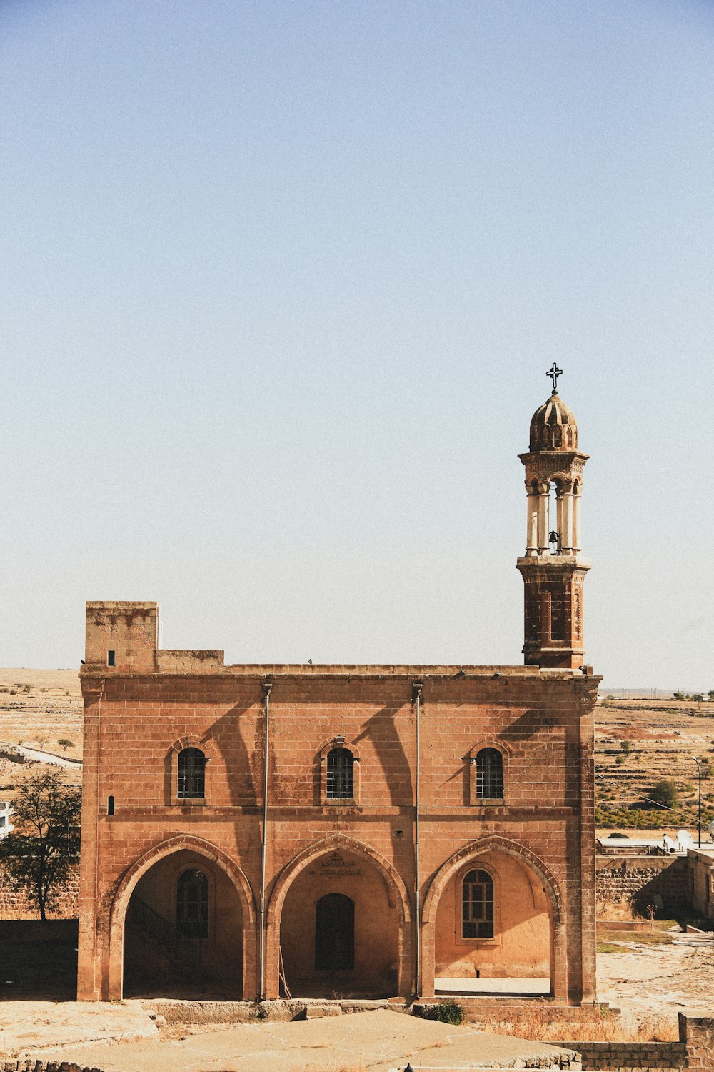 a large brick building with a tower