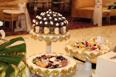 Sophisticated corporate event dessert table with clean lines and subtle golden details.