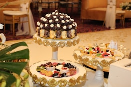 A stylish table set for a celebration with Iconic Pasteleria entremets as the centerpiece.