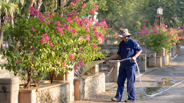 a police officer spraying flowers