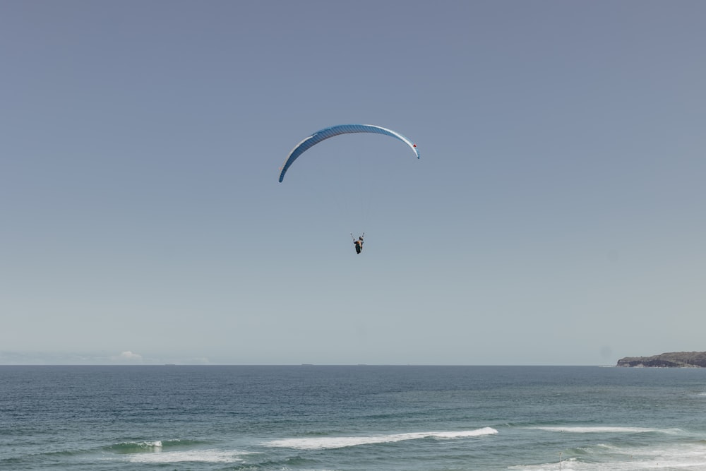 a person parasailing on the ocean