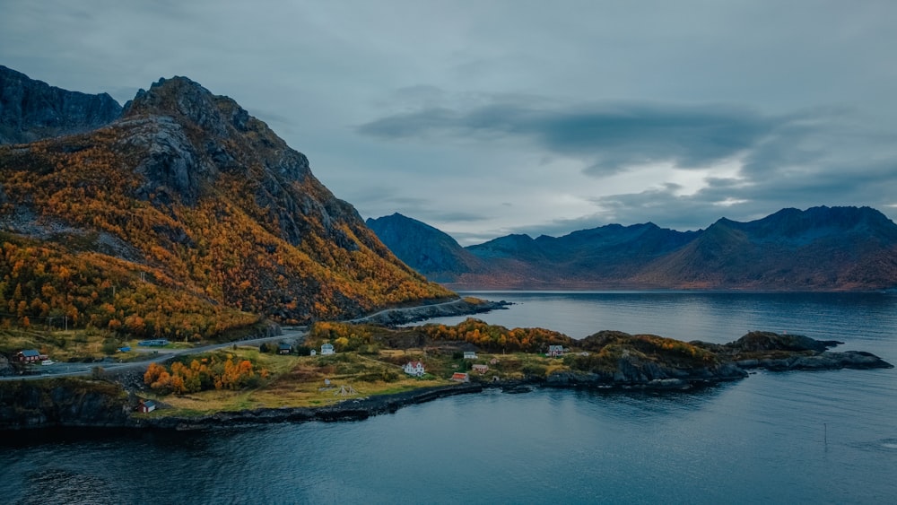 a body of water with mountains in the back