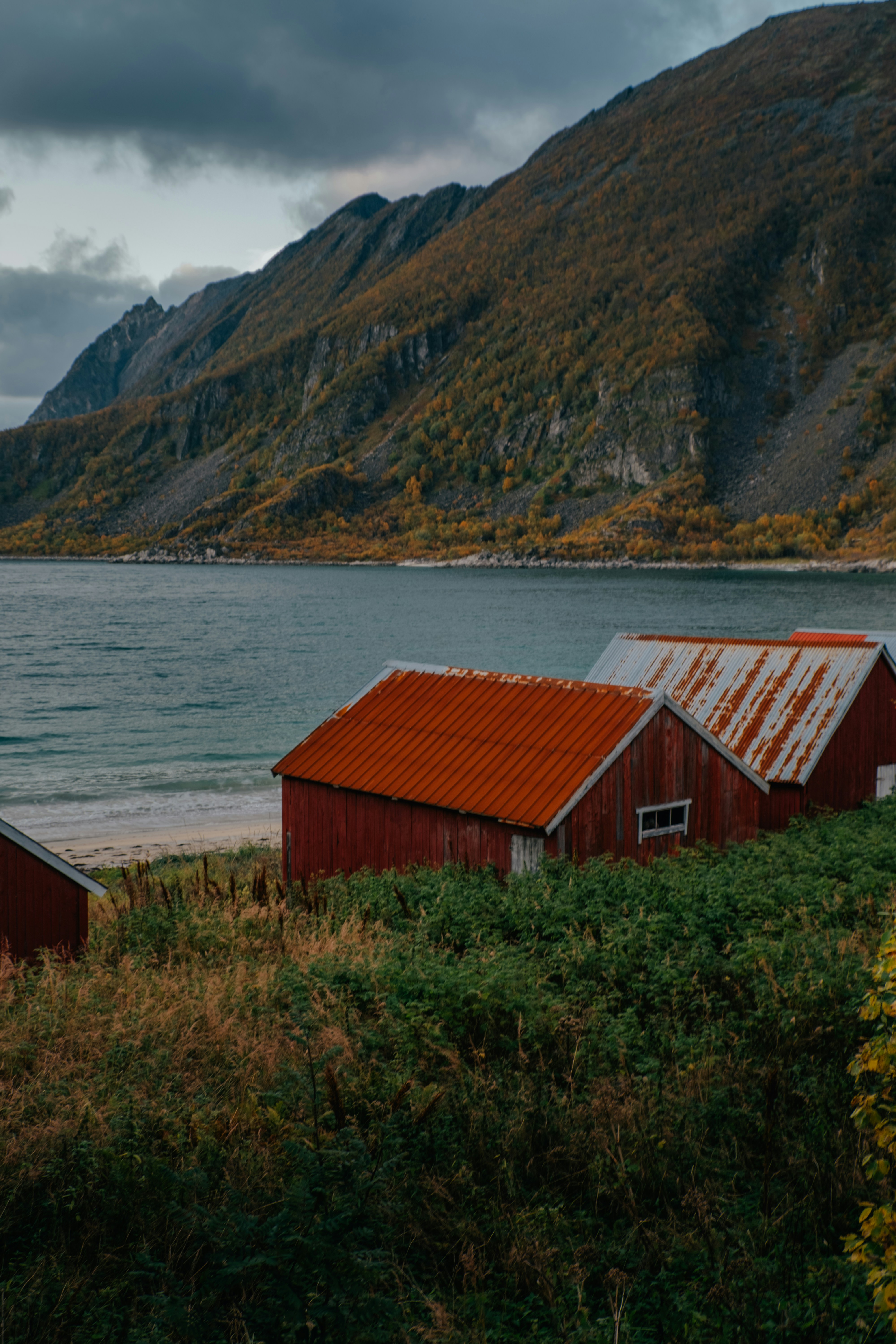 a red building by a lake