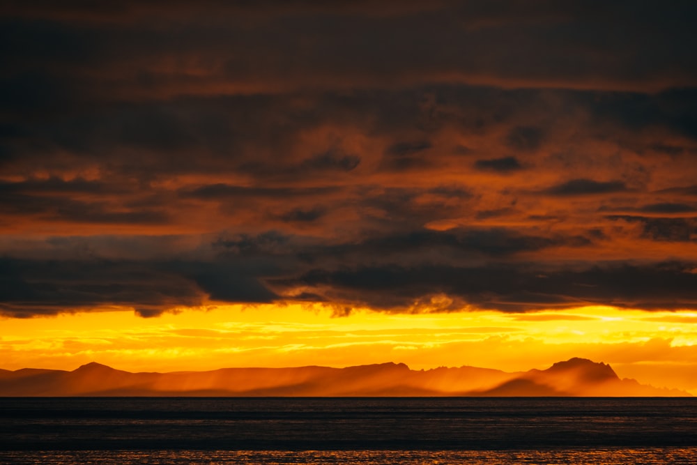 a sunset over a body of water