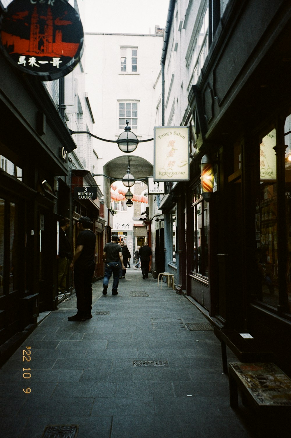 people walking down a sidewalk