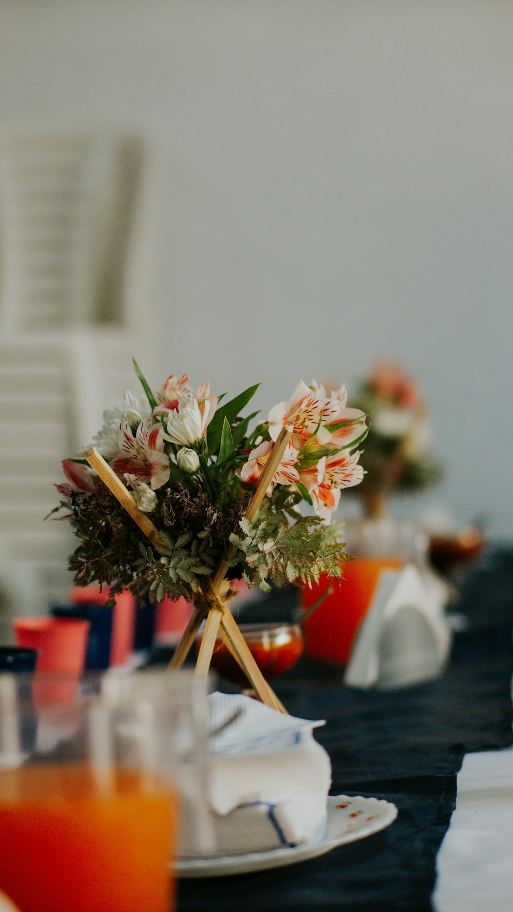 a vase with flowers on a table