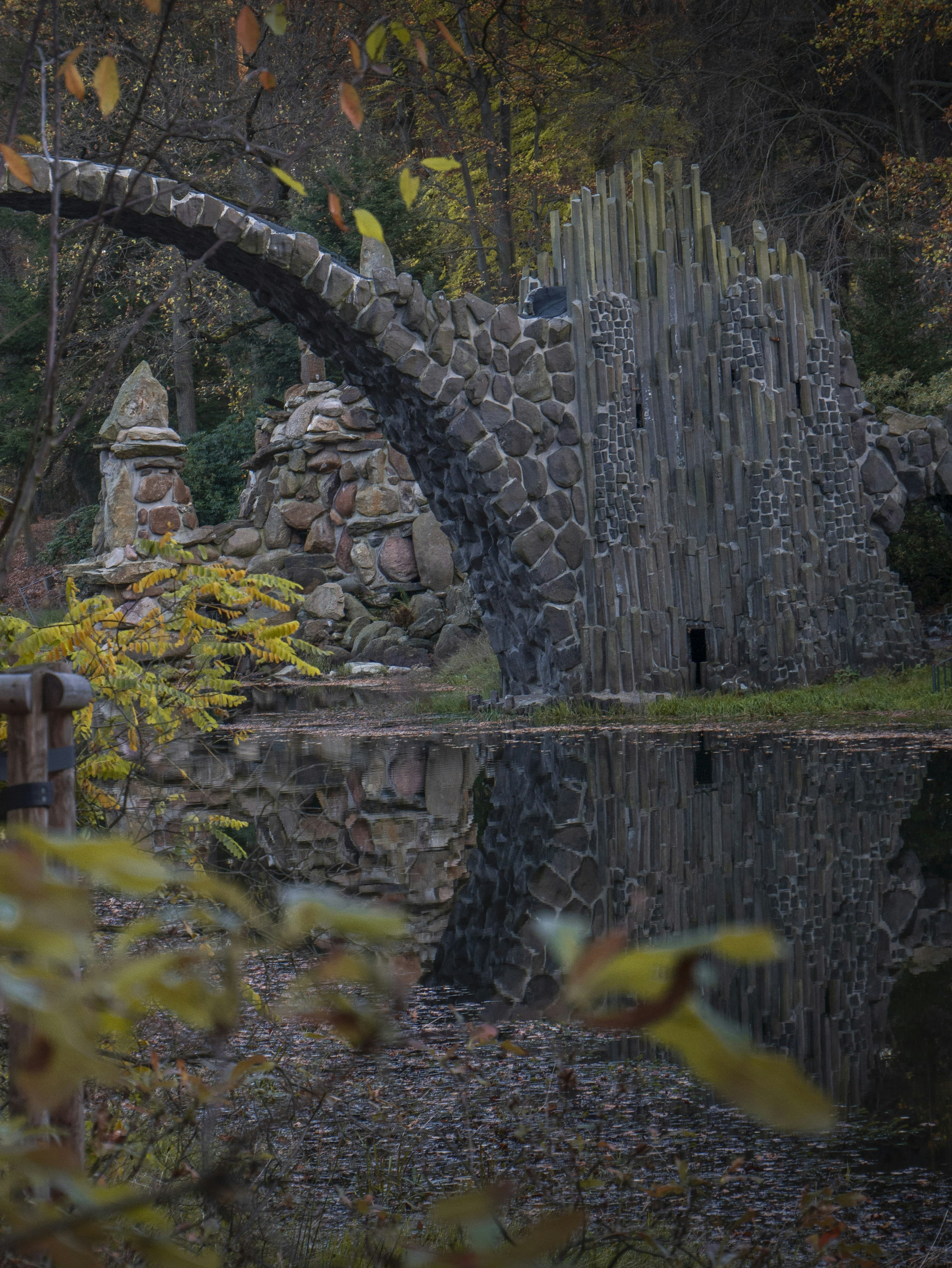 a stone wall with a stone tower