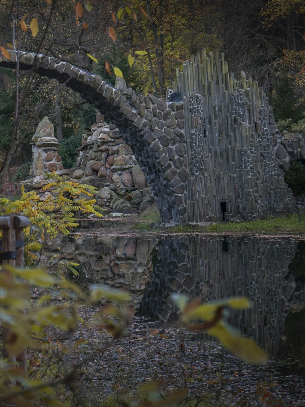 a stone wall with a stone tower