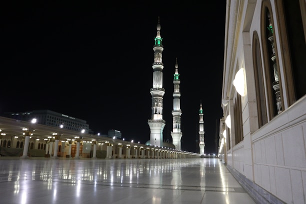 A serene view of the masjid courtyard bathed in soft morning light.