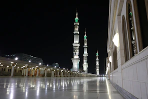The serene courtyard of Masjid al-Haram glowing softly at dusk.