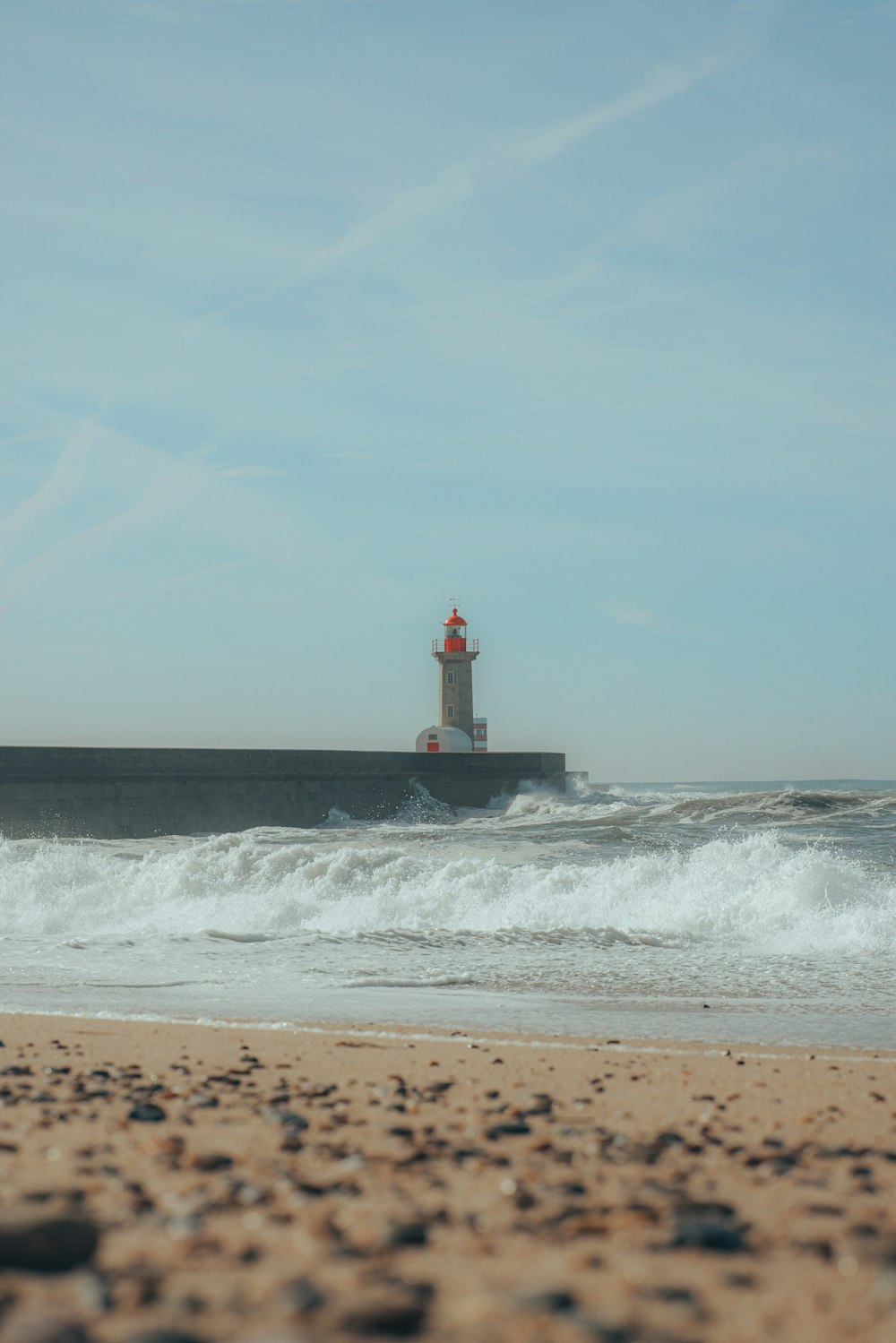 a lighthouse on a beach