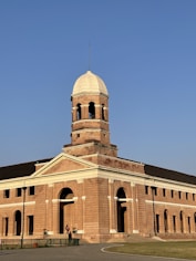a large brick building with a domed roof