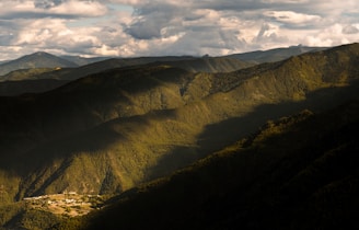 a valley with mountains in the background