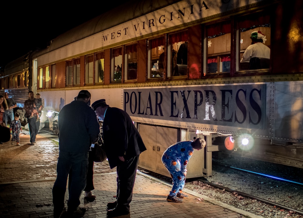 people standing near a train