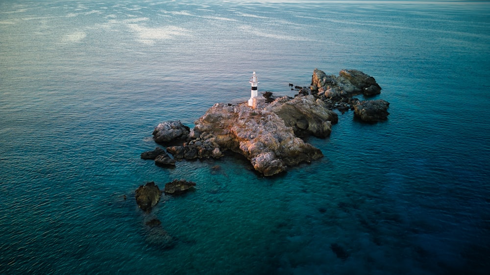 a lighthouse on a rocky island