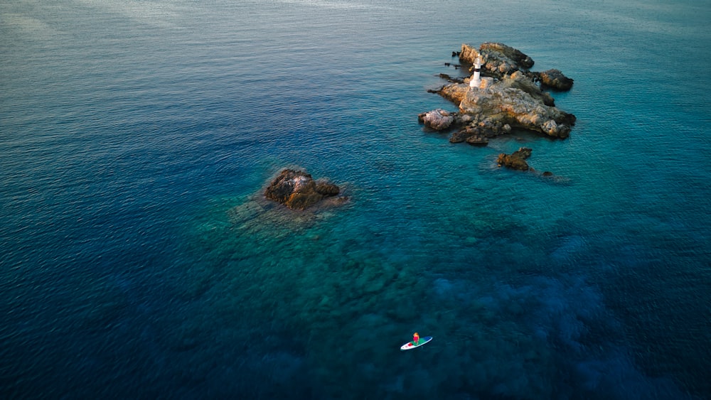 a group of rocks in the water