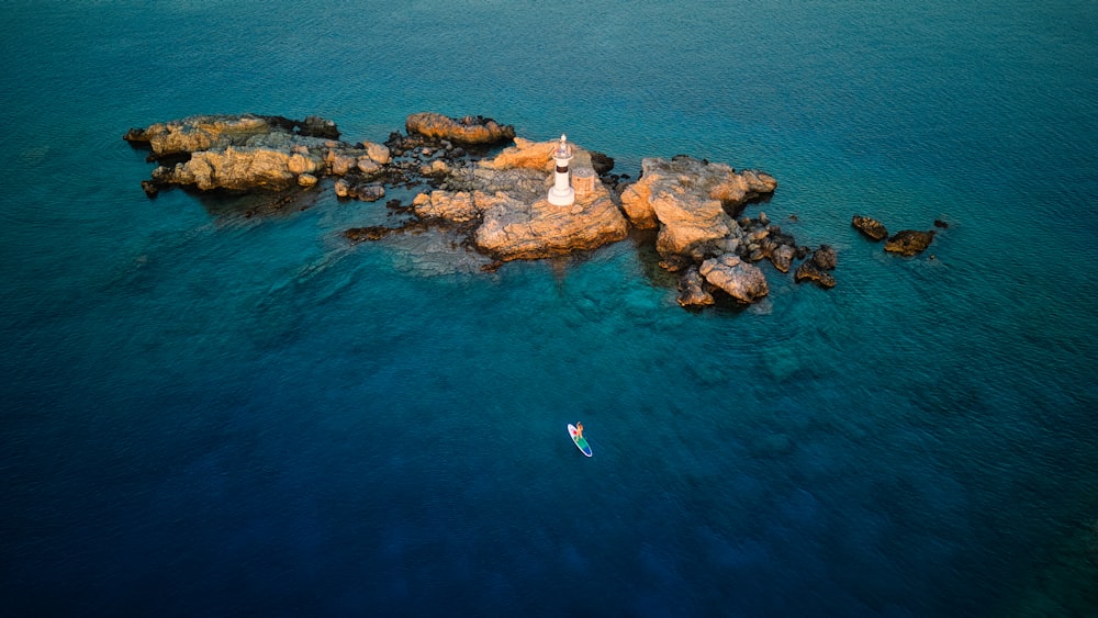 a group of rocks in the water