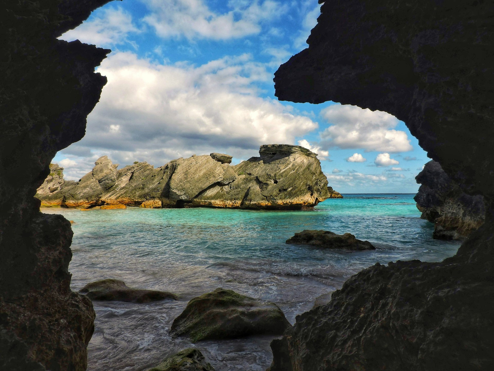 a rocky beach with a large body of water