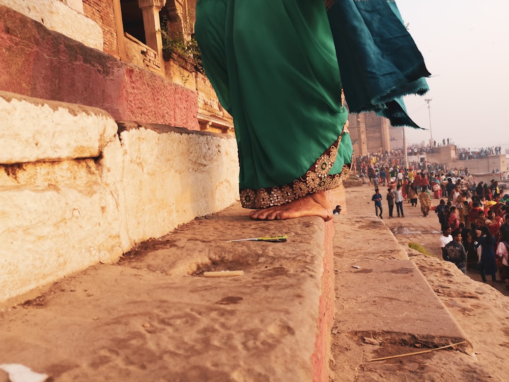 a person standing on a ledge