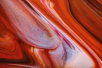 Fluid abstract patterns with bold, swirling lines and vibrant colors, creating a sense of movement and depth.