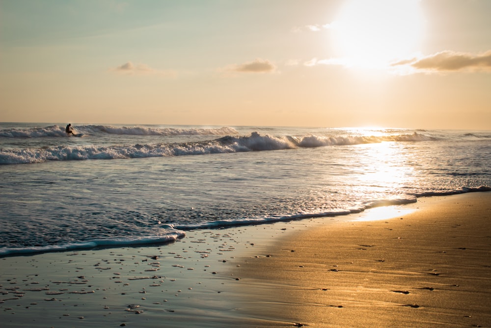 a person surfing in the sea