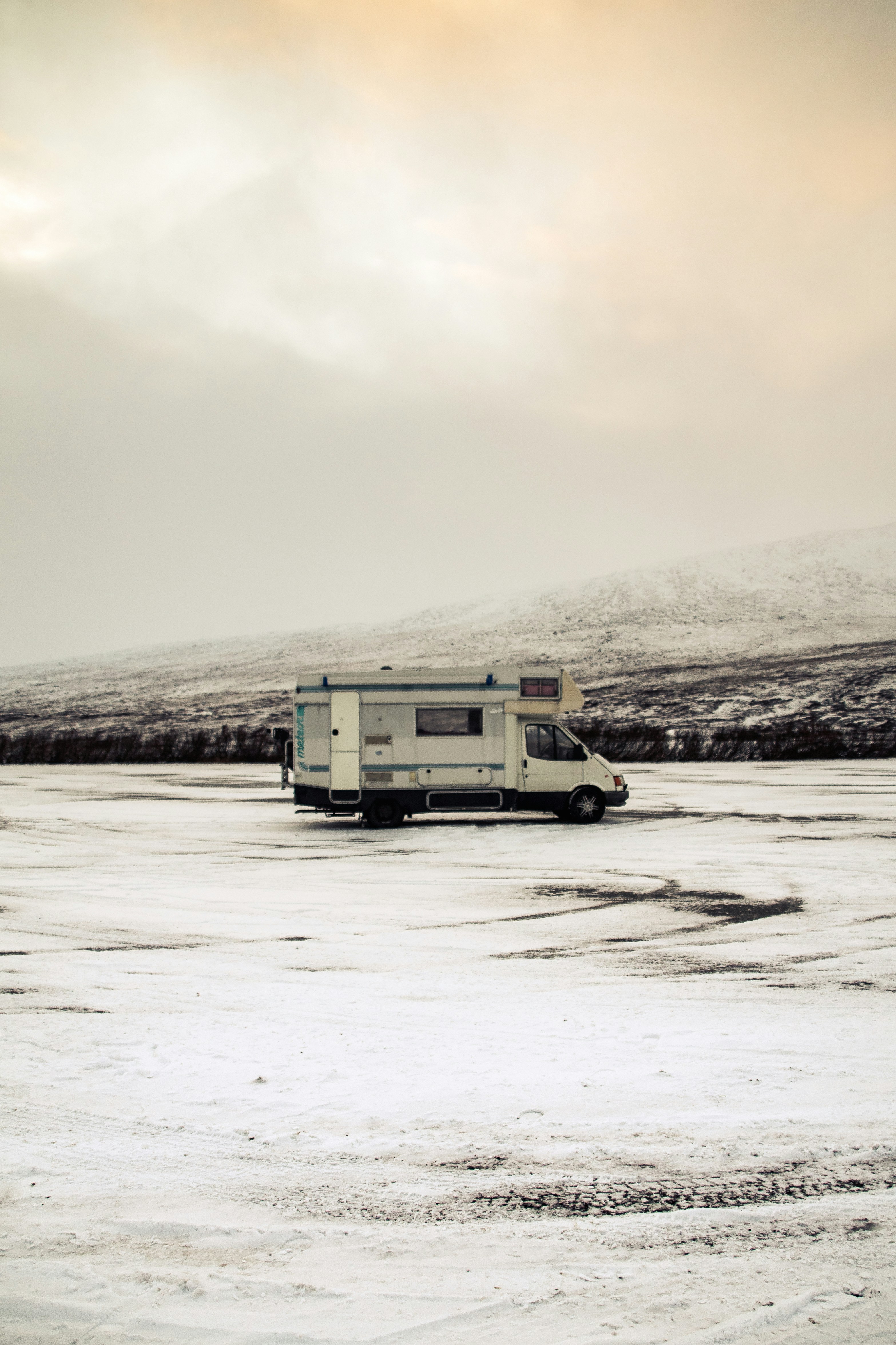 a truck parked in a snowy field