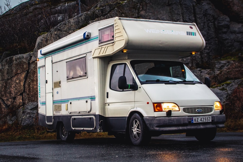 a white van with a large metal tank on top