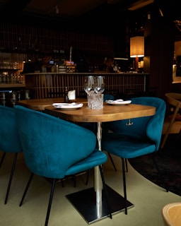 a table with blue chairs