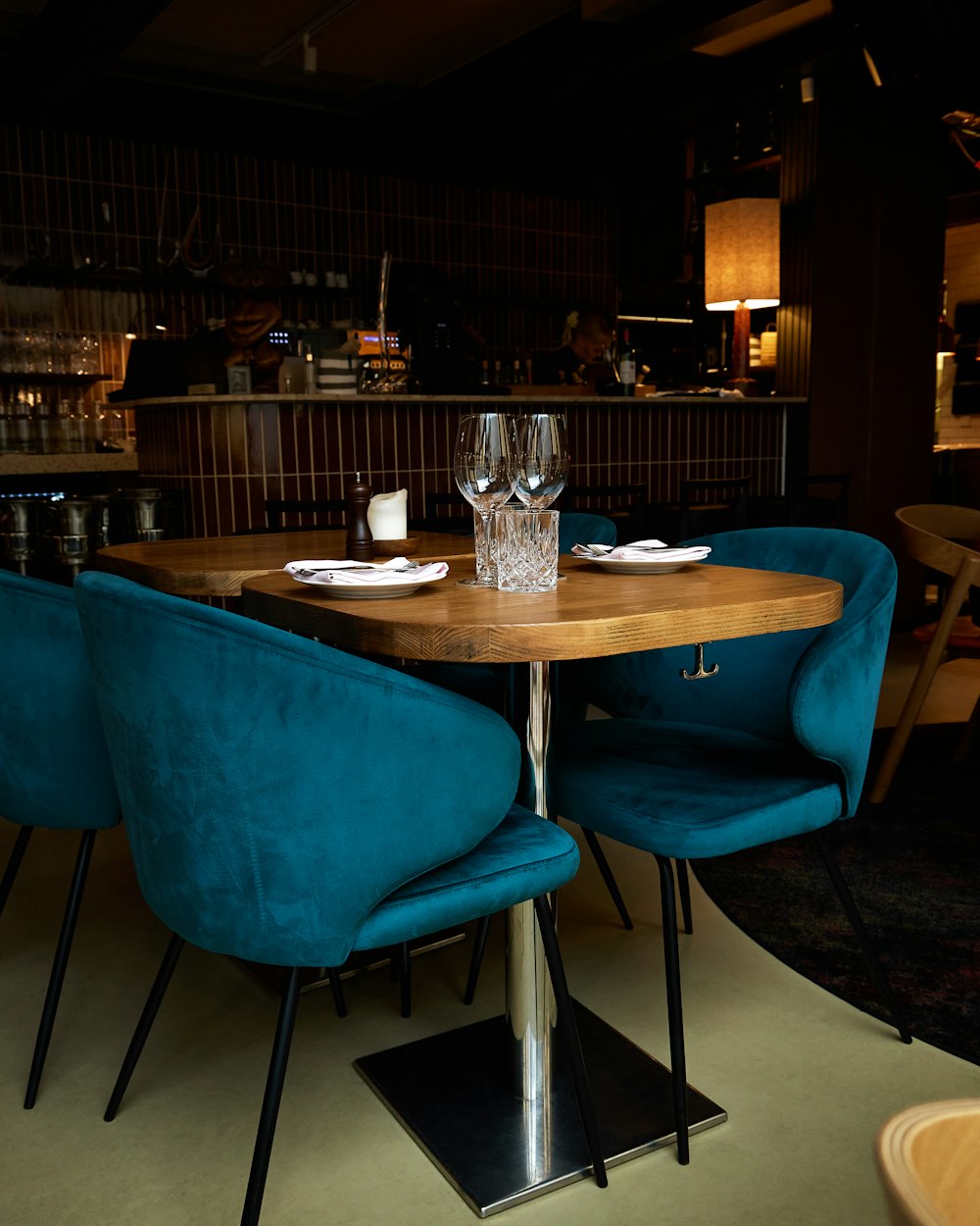 a table with blue chairs