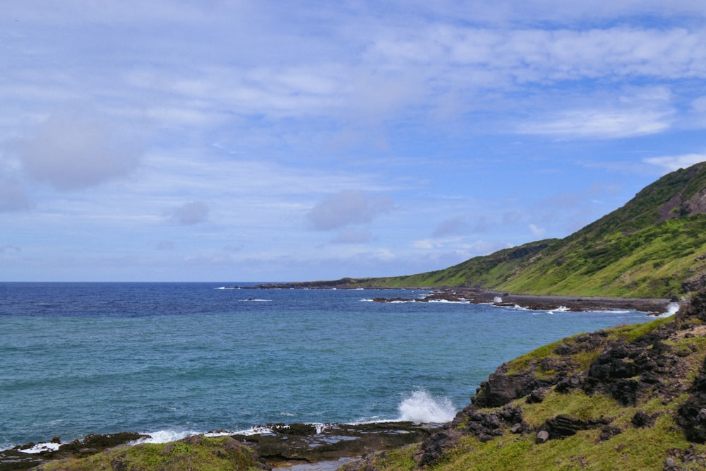 a body of water with hills around it