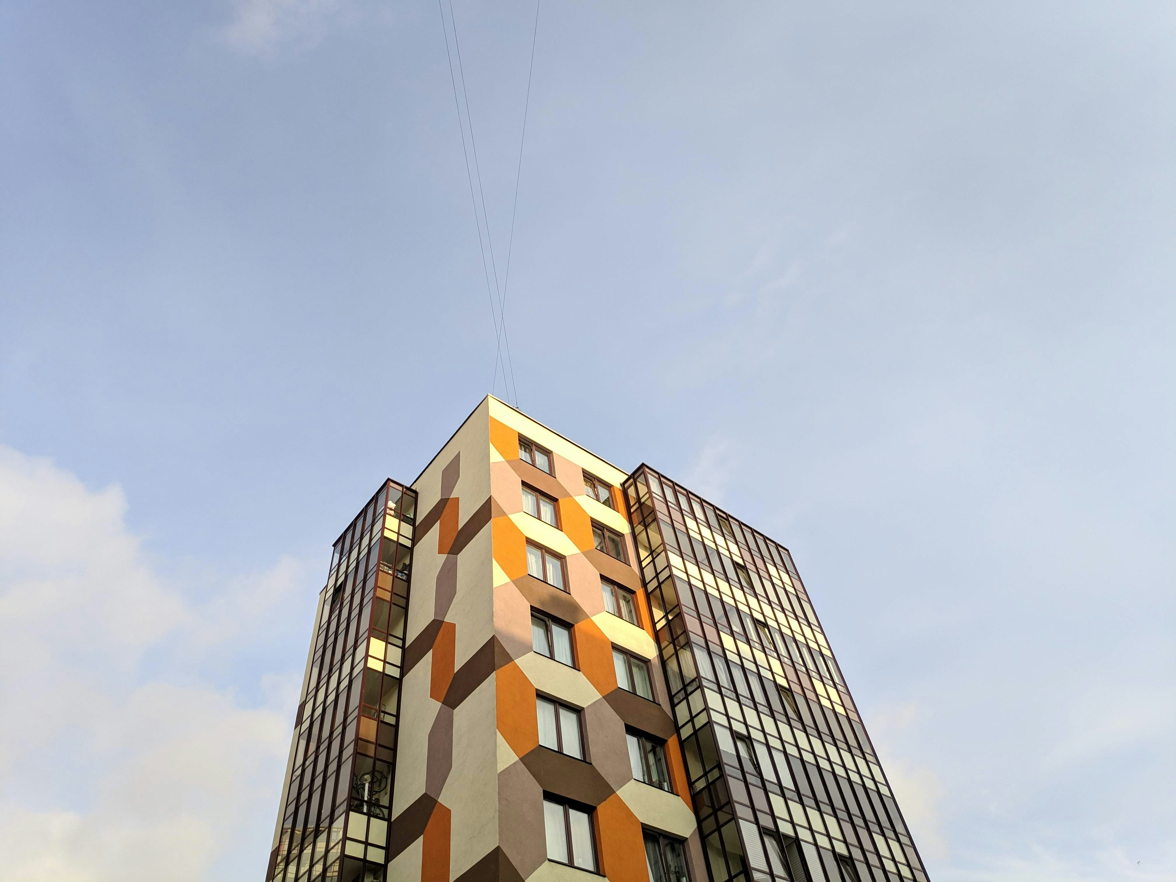 a tall building with a blue sky