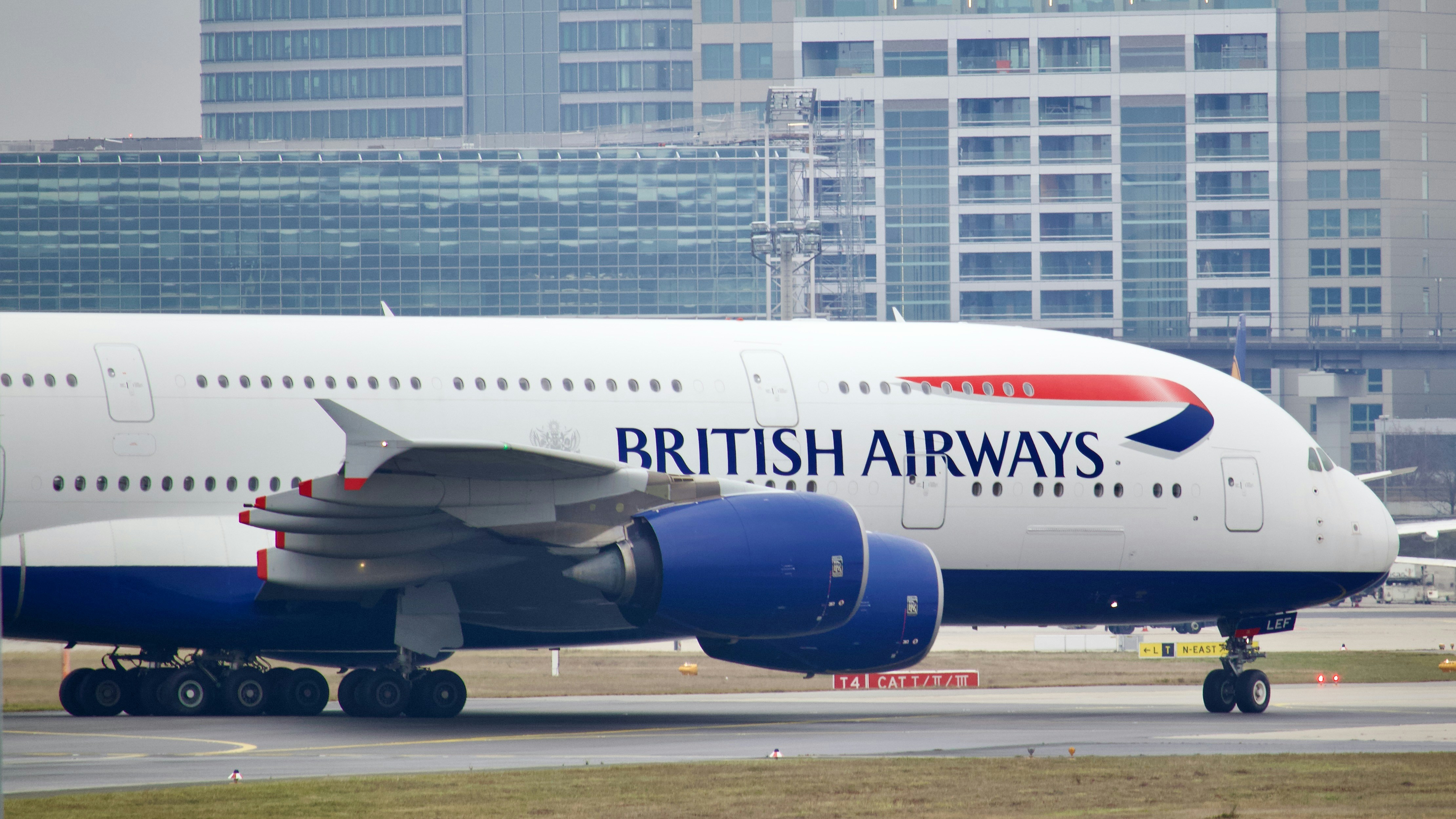 a large airplane on the runway, British Airways Airbus A380 taxiing at Frankfurt Airport
