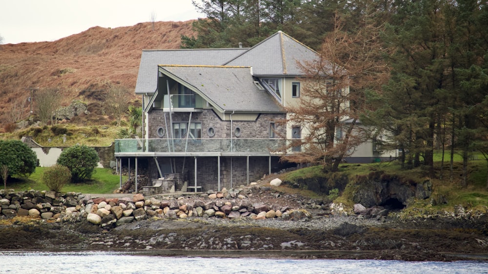 a house on a rocky shore