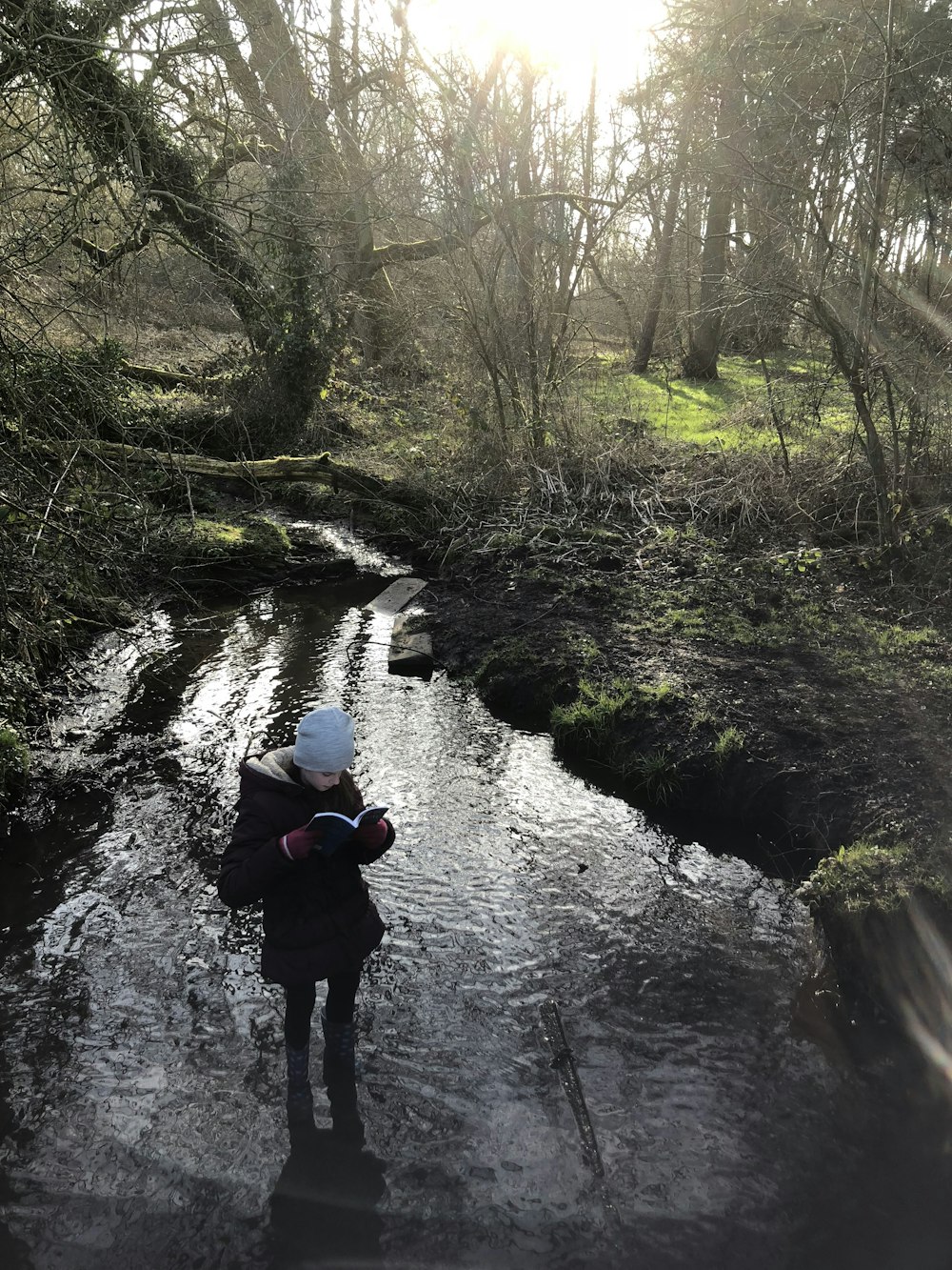 a person standing in a stream