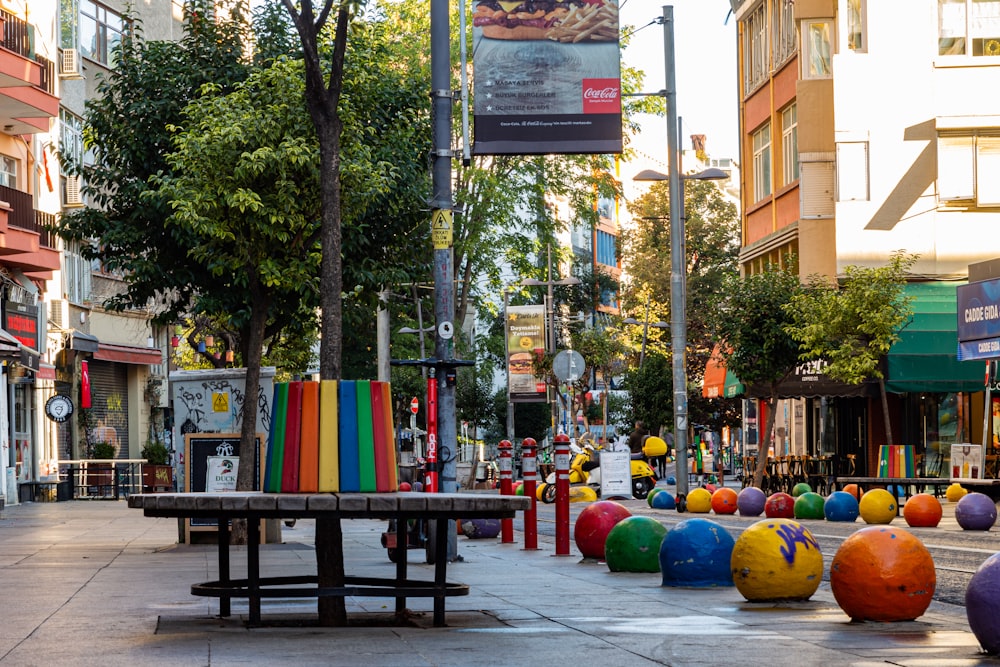 a street with a bench and balloons