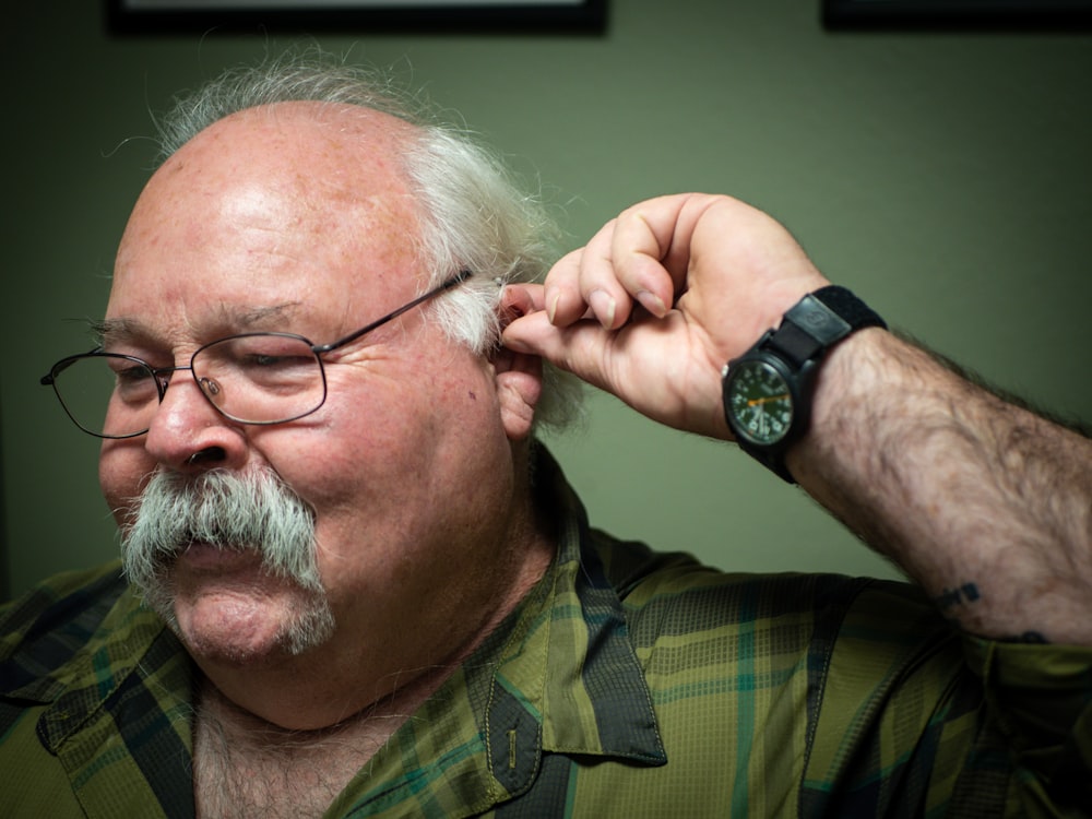 a man with a beard and glasses