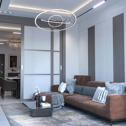 A sleek, modern living room showcasing a blend of contemporary design and warm lighting.