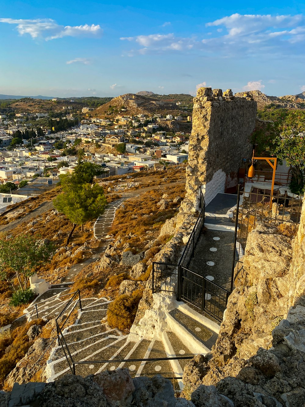 a view of a town from a cliff