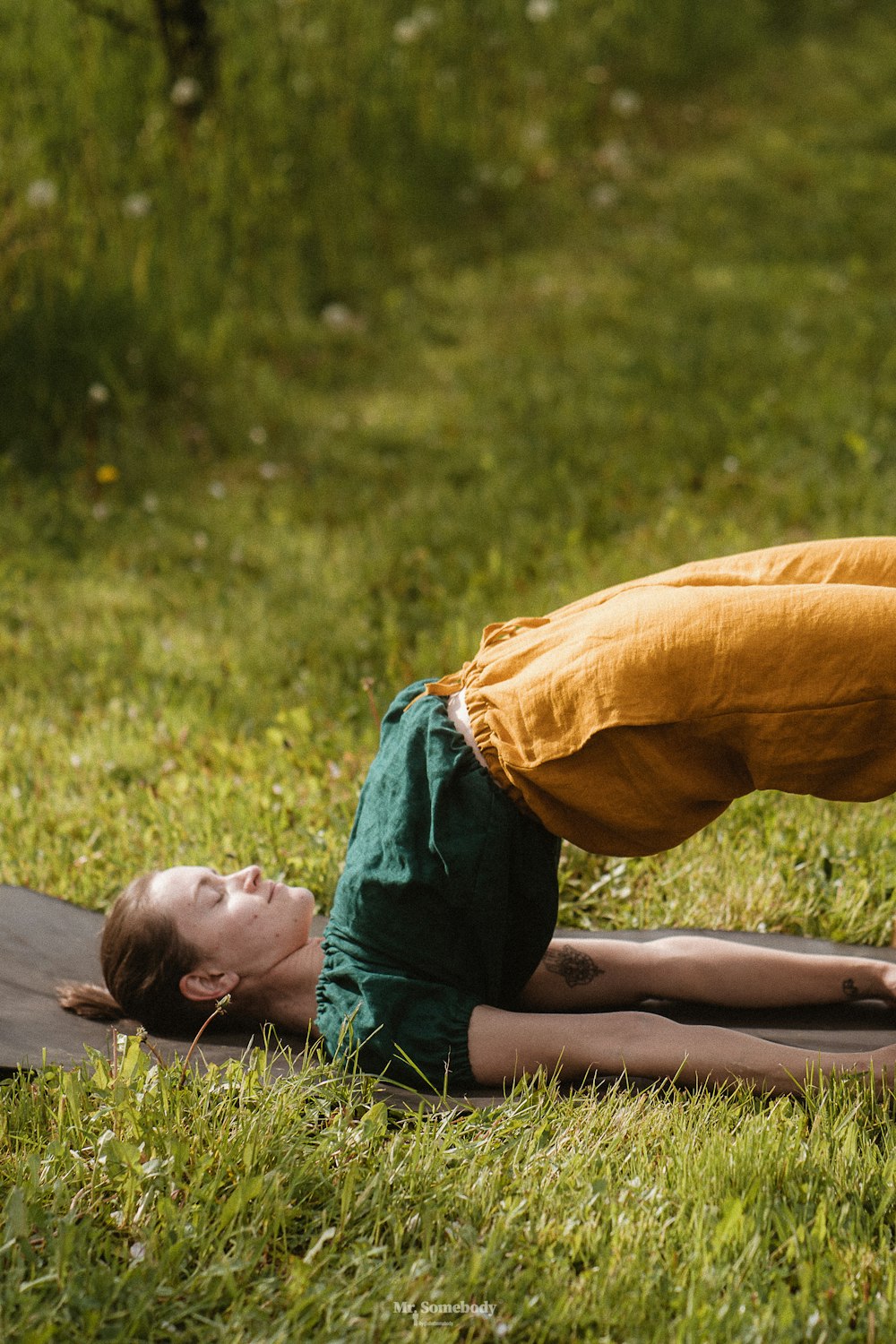 a person lying in the grass